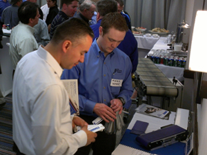 The Knotts Company's Mark Howe shows an attendee what's new from Dorner Conveyors